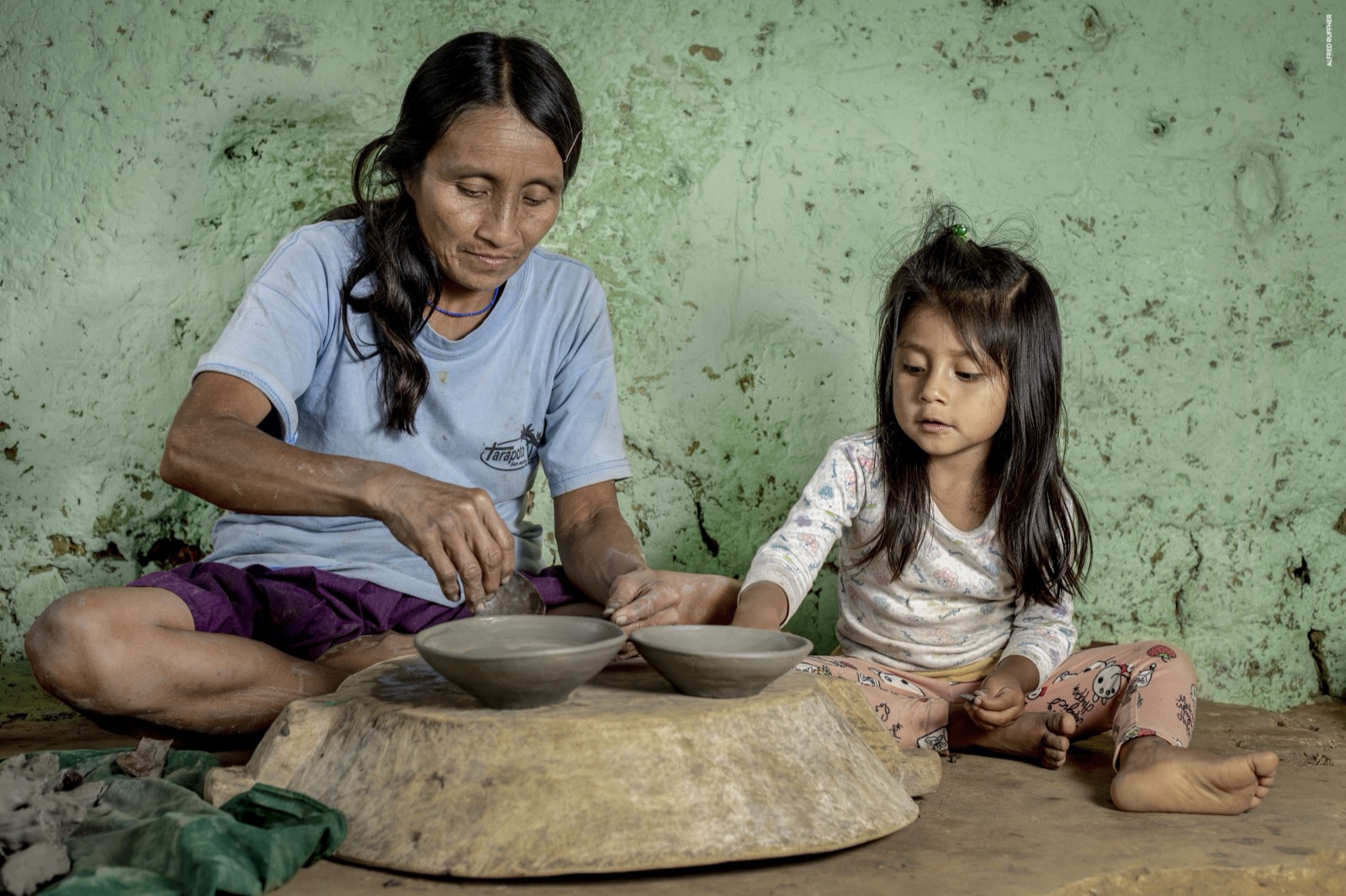 Indigenous potter with daughter
