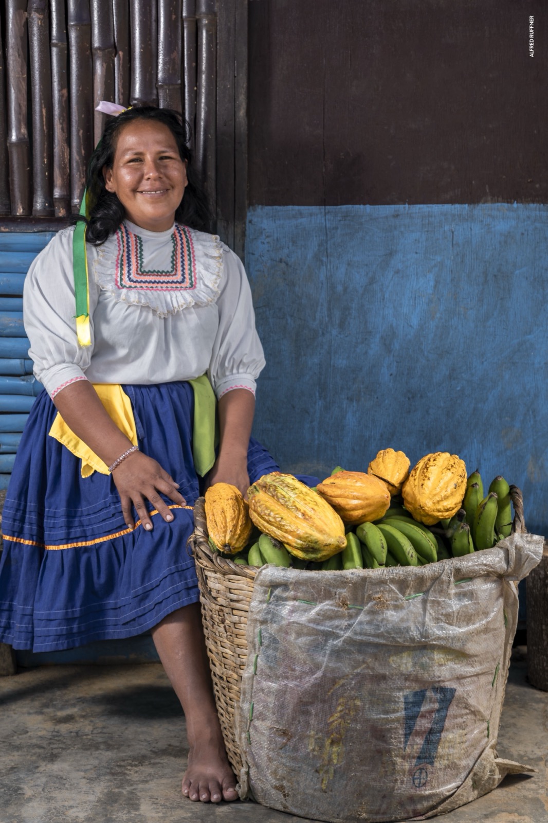 Woman with cacao and banana basket