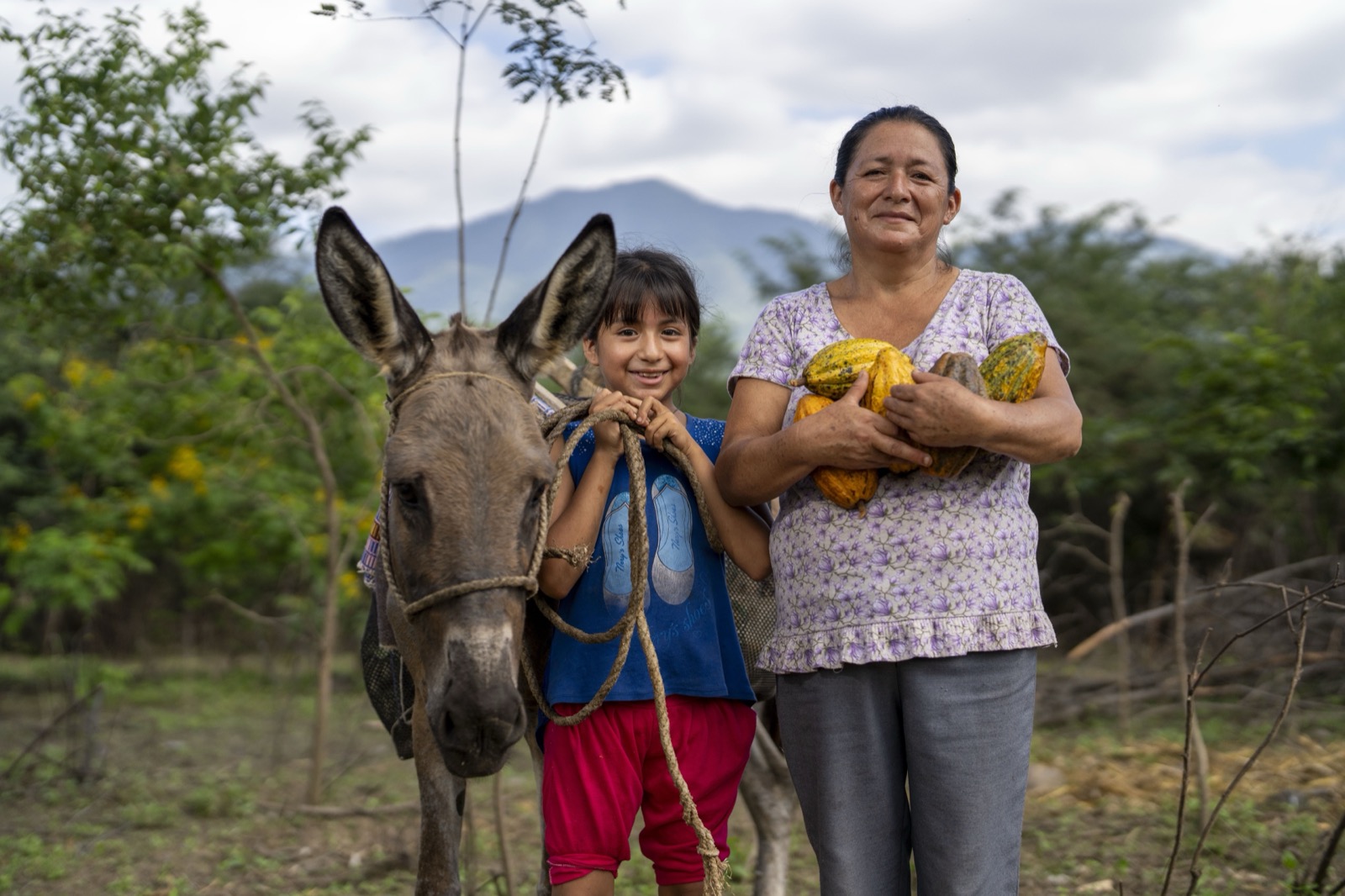 Grandmother and granddaughter with cacao