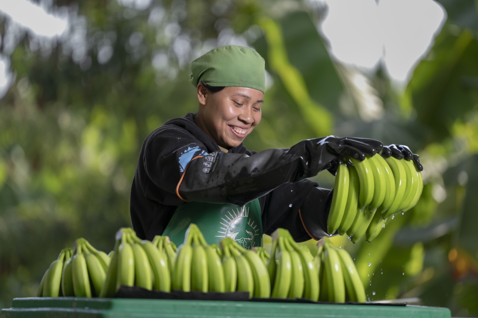 Woman processing bananas