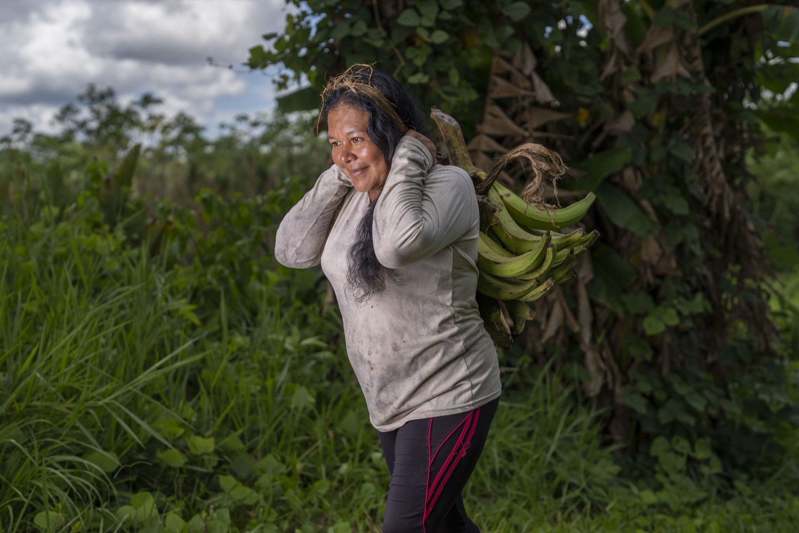 Woman carrying bananas
