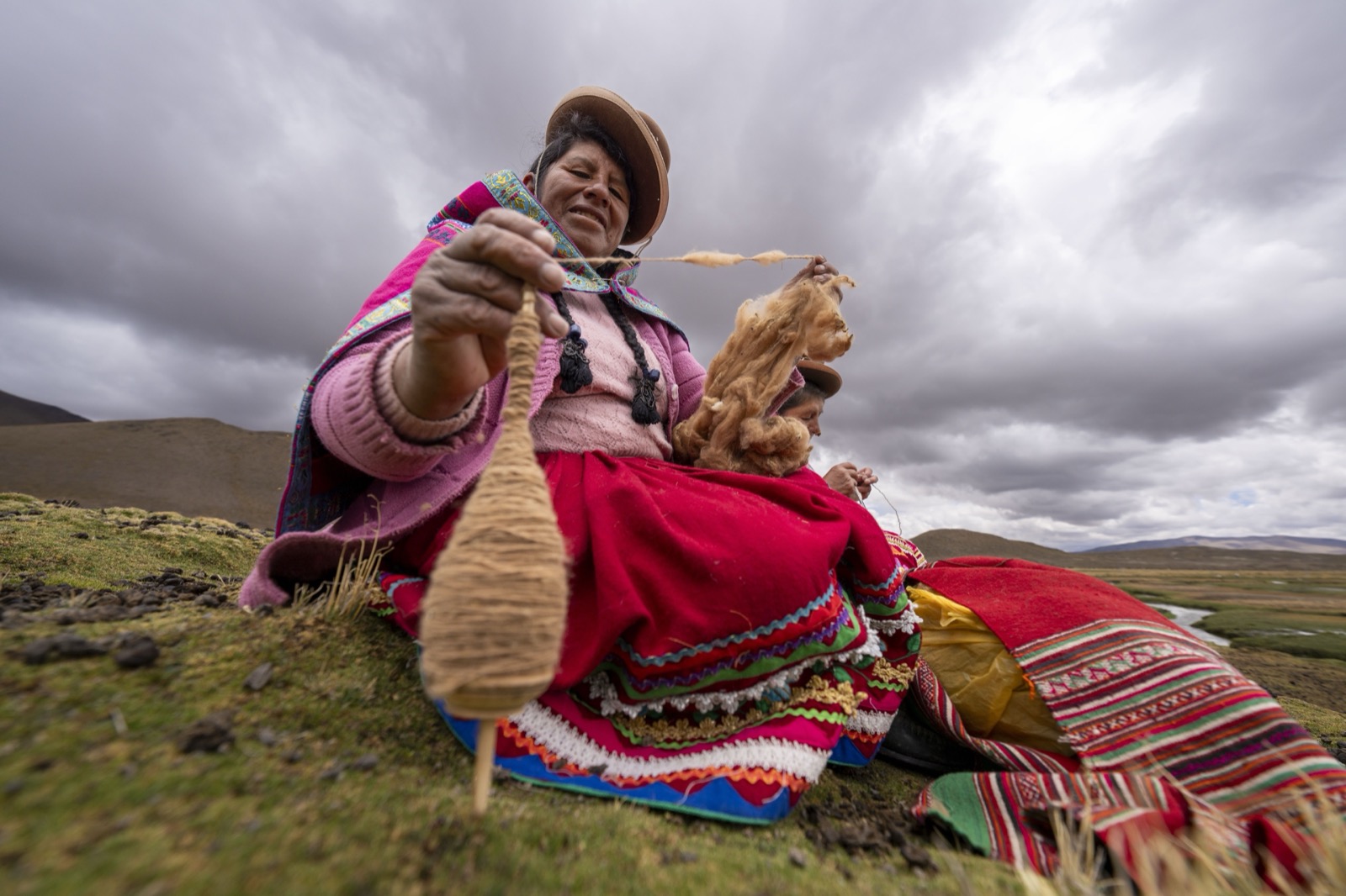 Andean woman spinning wool