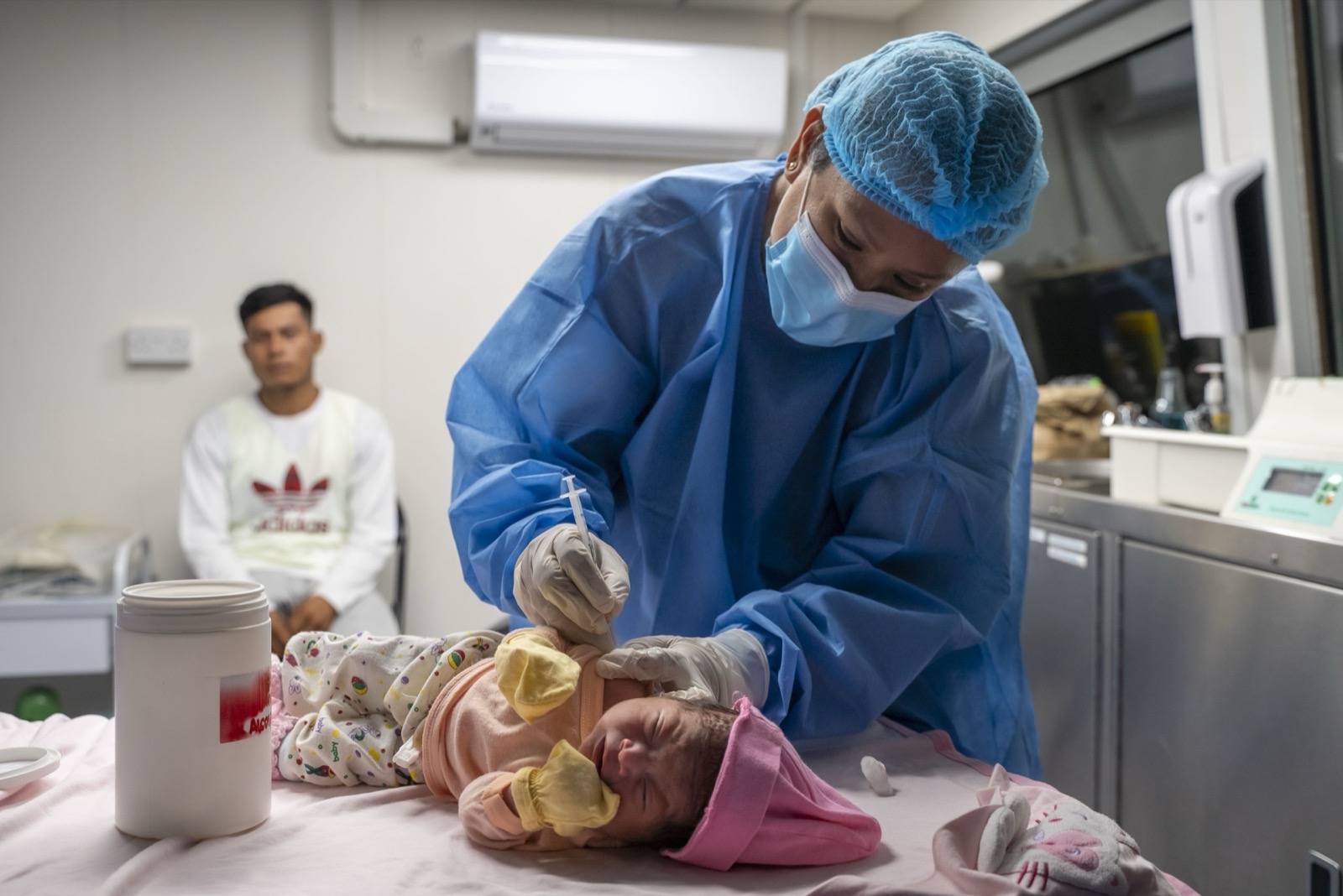 Nurse attending newborn baby